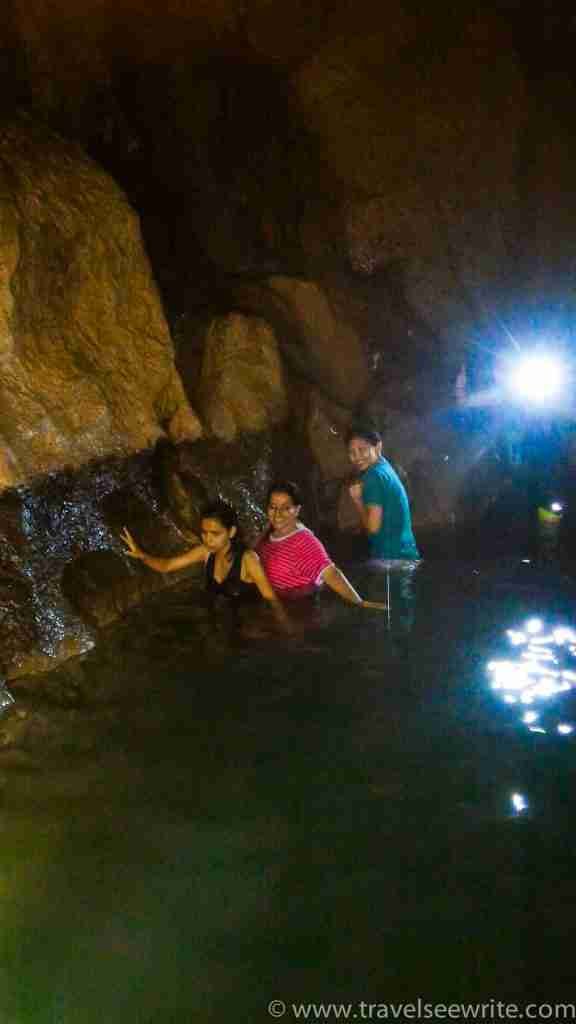 Crossing the icy cold 10 feet deep water pool, Sagada