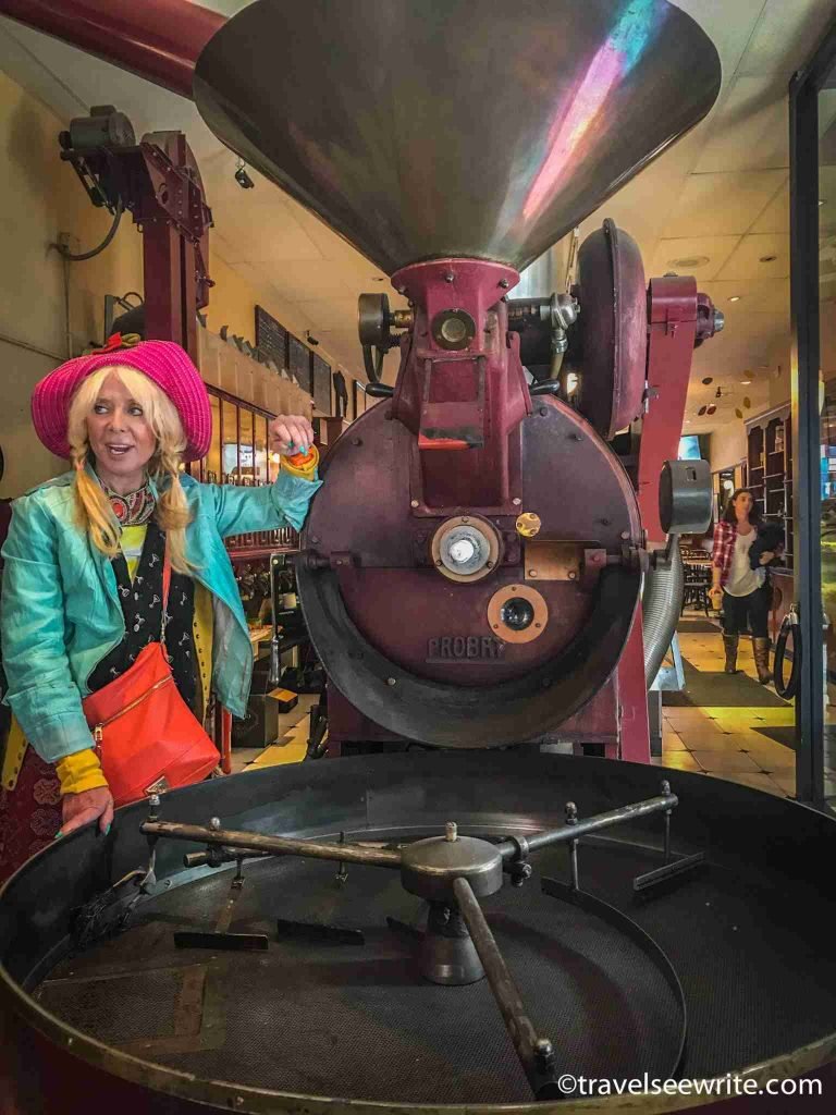 Blandina explaining coffee roasting at Cafe Roma, North Beach, San Francisco