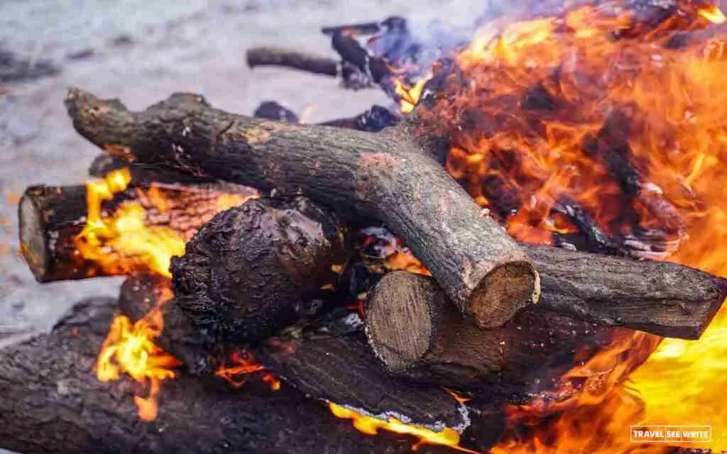 Best things to do in Varanasi in 3 days - Visit Manikarnika Ghat where the funeral pyres have burnt nonstop for thousands of years