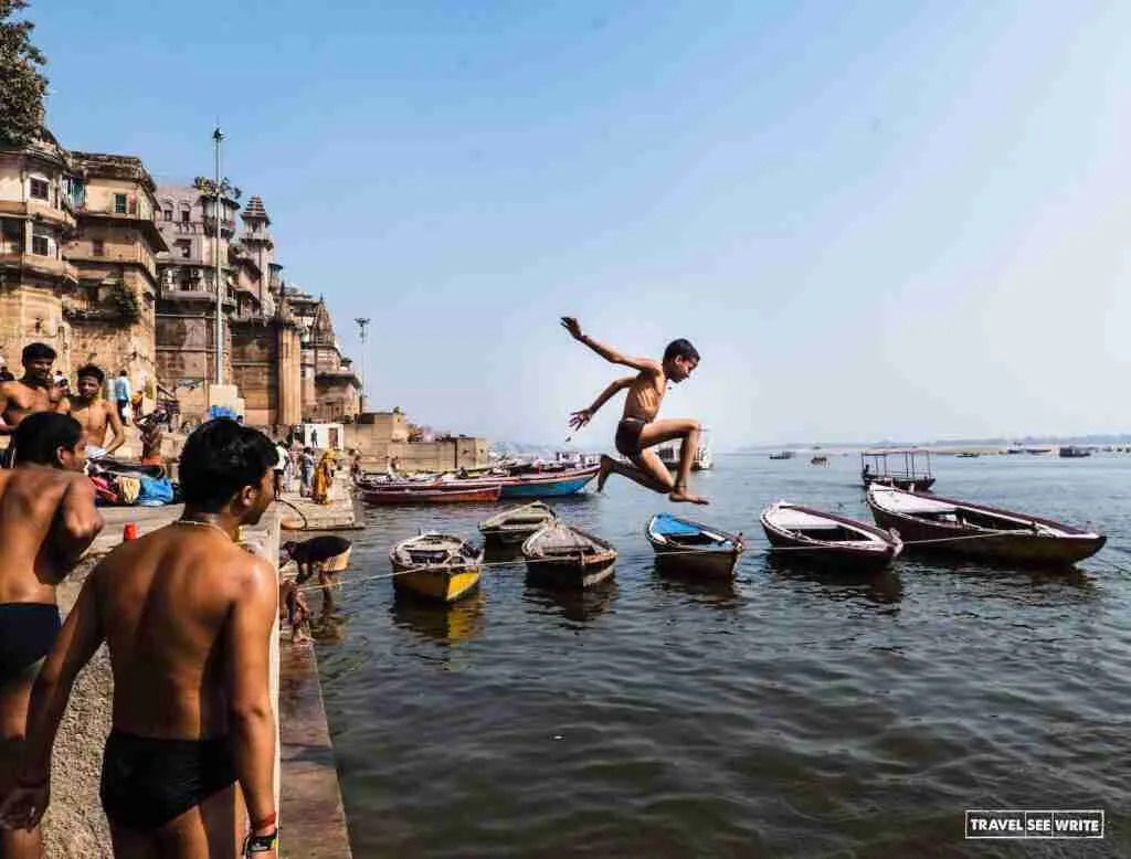 Young boys jumping into the River Ganges in Varanasi