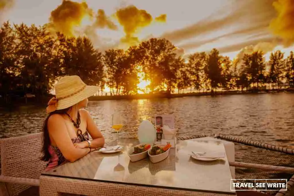 Enjoying the setting sun in Andaman Sea and Angsana Villas Lagoon from Atoll Phuket