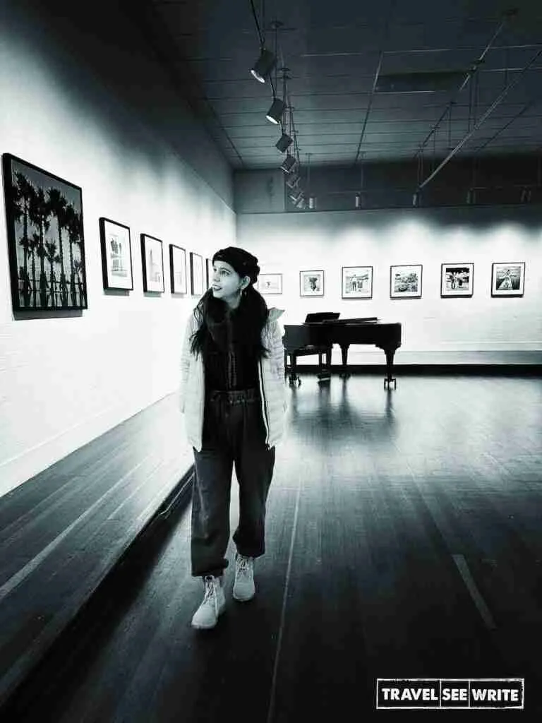 Checking out a photography exhibition at Pacific Grove Art Center, Monterey, California