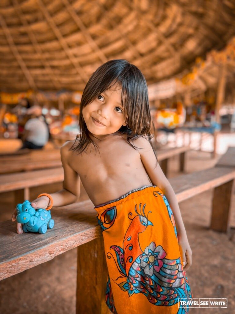 Embera Women and kids wear vibrant skirts known as parma, wrapped like sarongs.