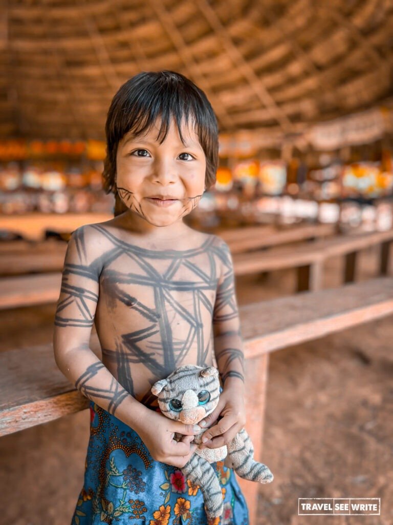 A child wearing a local Embera tattoo called jagua made from plant-based dyes that last around two weeks.
