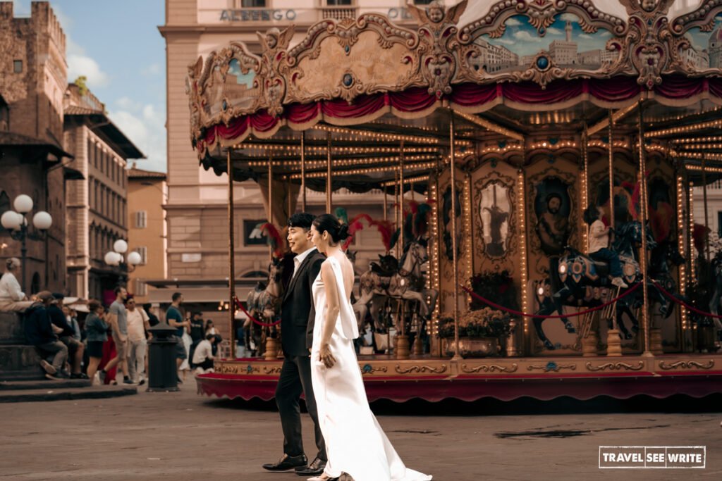 Located opposite Caff&egrave; Gilli, the Picci Family Carousel is a historic, hand-painted merry-go-round prized as a whimsical backdrop for pre-wedding photo spot in Firenze, Italy