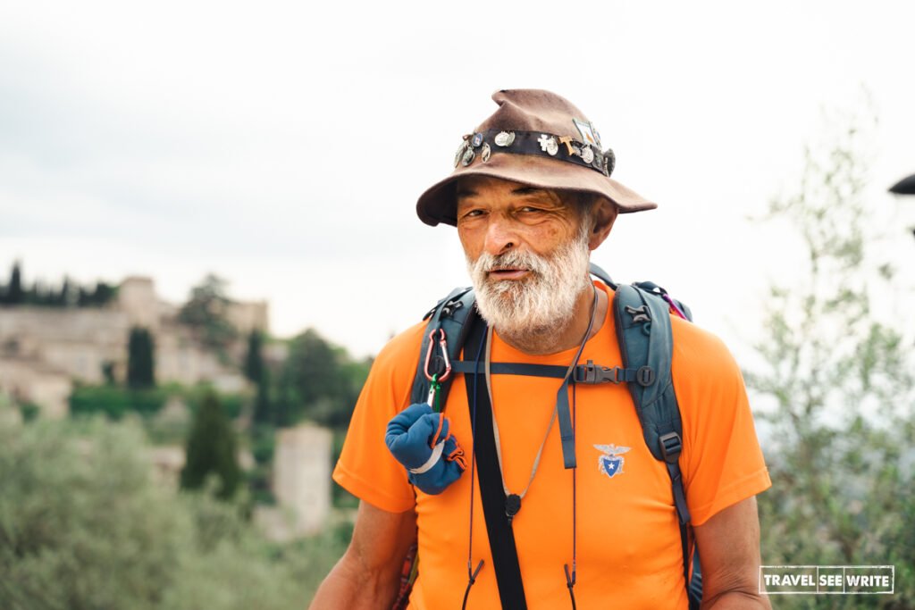 Fiore, a determined 65-to-70-year-old pilgrim from Padova, walks the historic St. Antonio path on an inspiring 600-kilometre journey from Bologna to Rome.